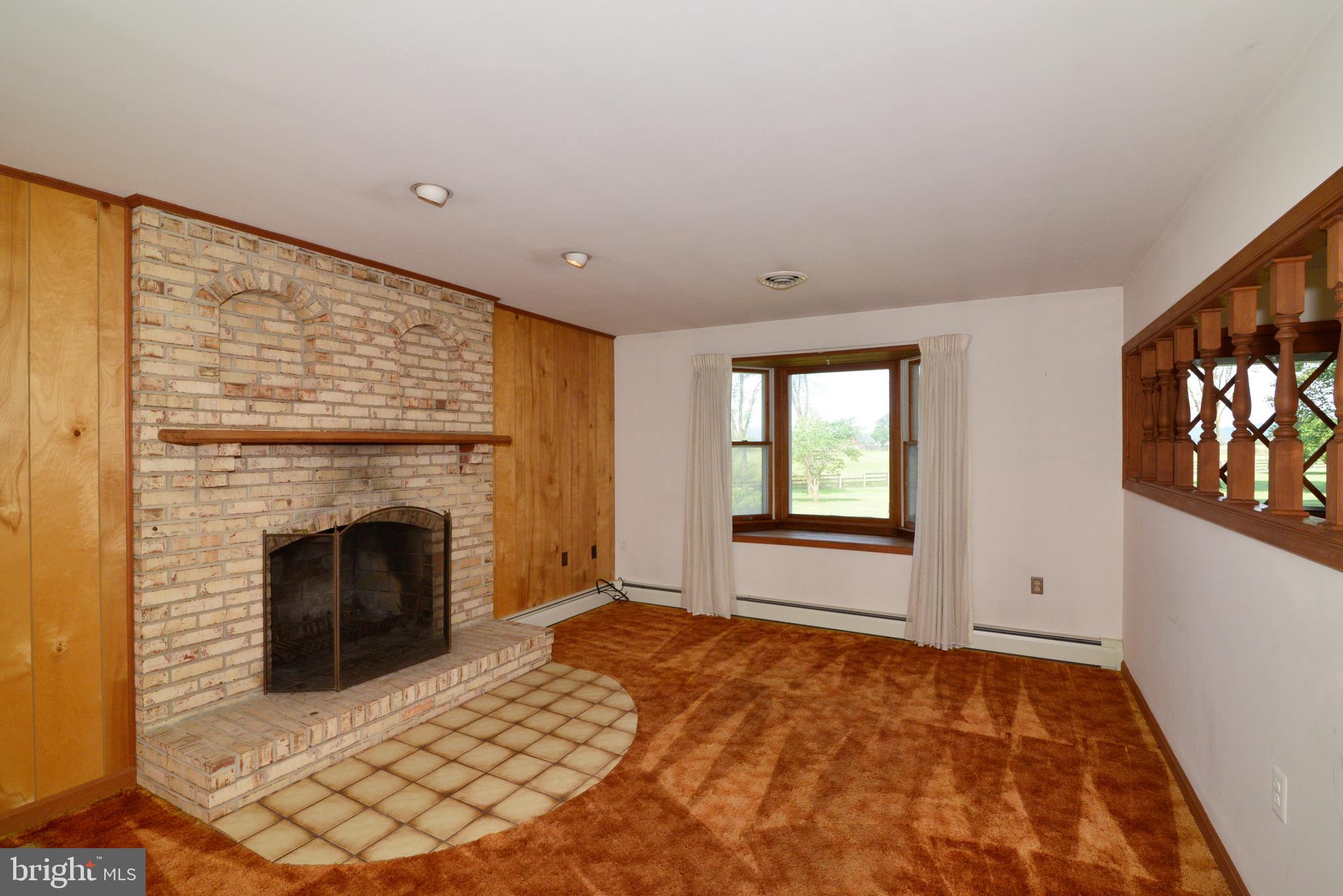 43157 Lucketts Road Leesburg, VA 20176 - Photo 9 of 56 Living room with brick wood-burning fireplace