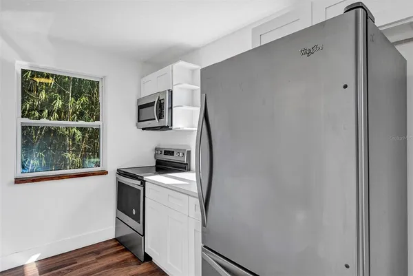 a kitchen with a stove and a microwave