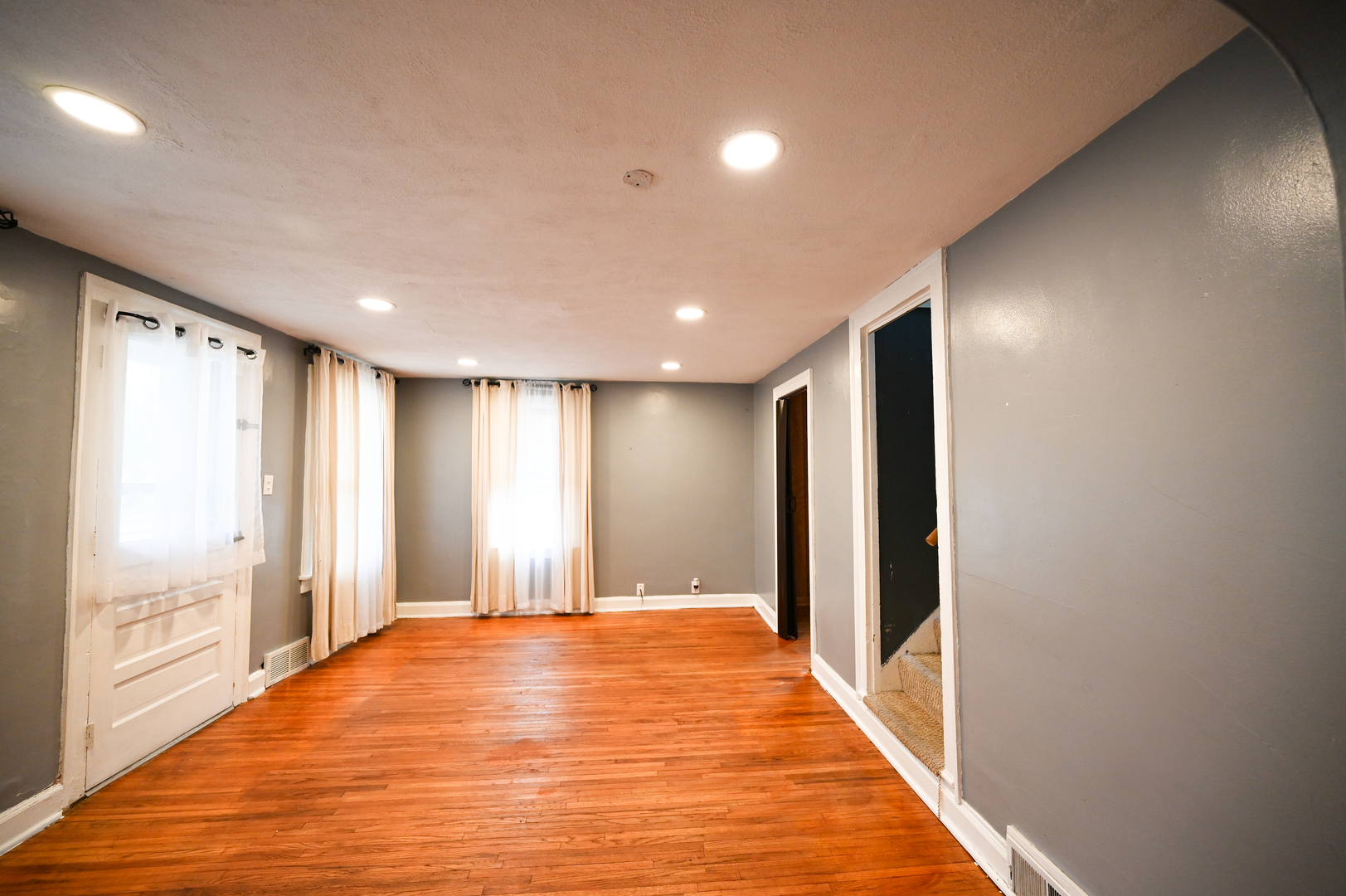 219 South 7th Street DeKalb, IL 60115 - Photo 12 of 30 a view of an empty room with wooden floor