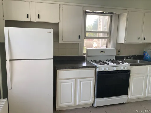 a kitchen with a stove and a refrigerator