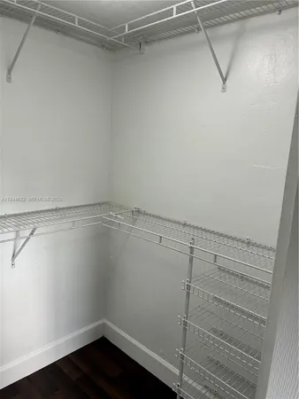 a view of a room with racks on the wall