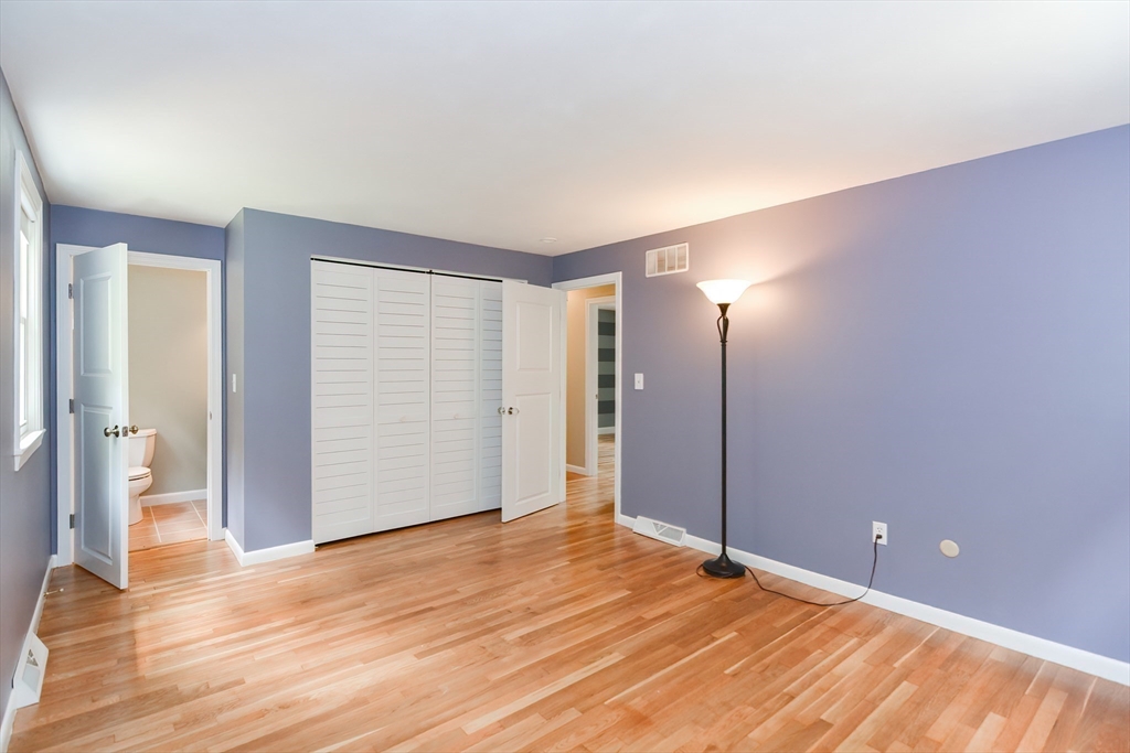 18 Green Valley Road Medway, MA 02053 - Photo 25 of 42 an empty room with wooden floor and windows