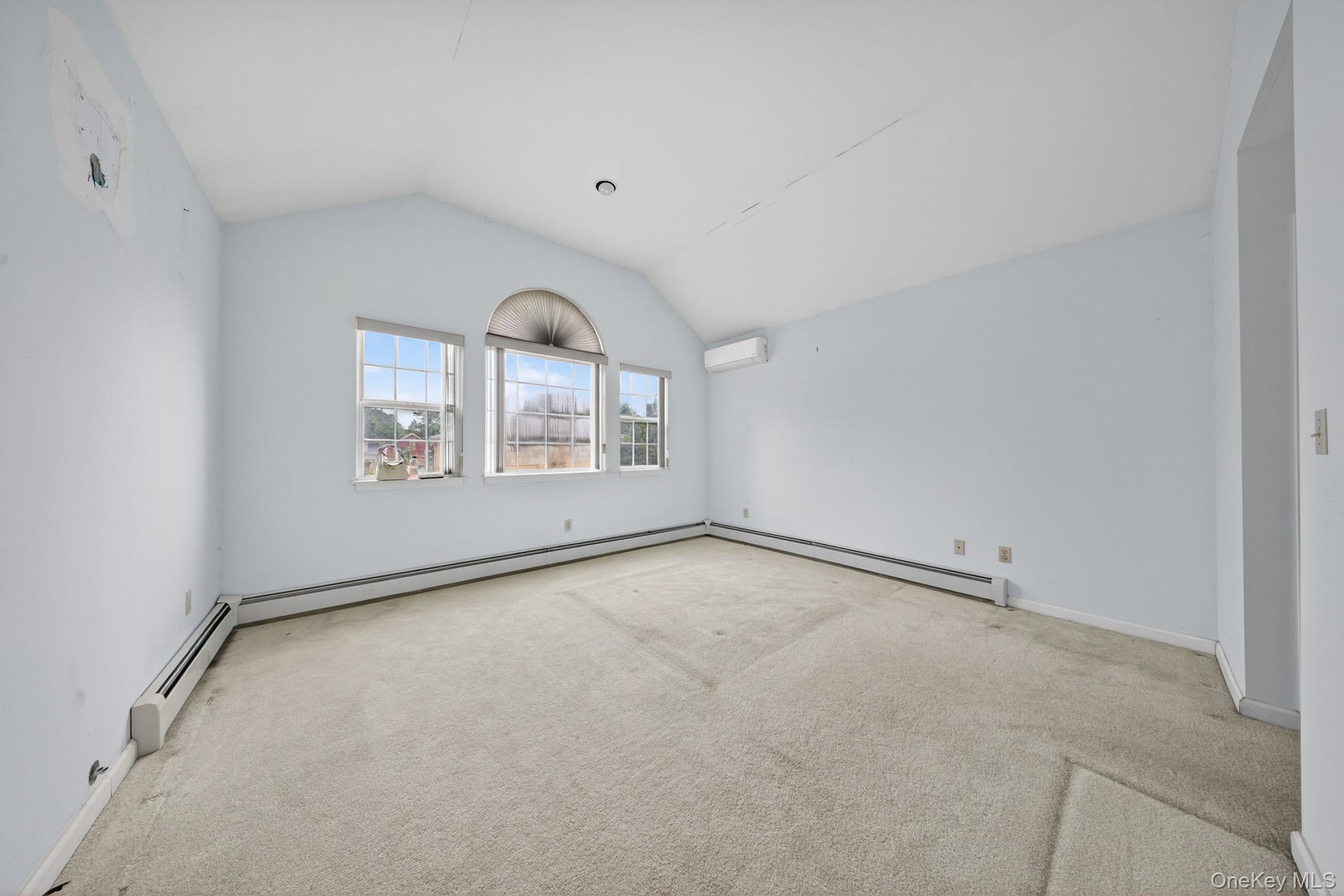 82 B Inwood Road Port Washington, NY 11050 - Photo 18 of 41 an empty room with windows