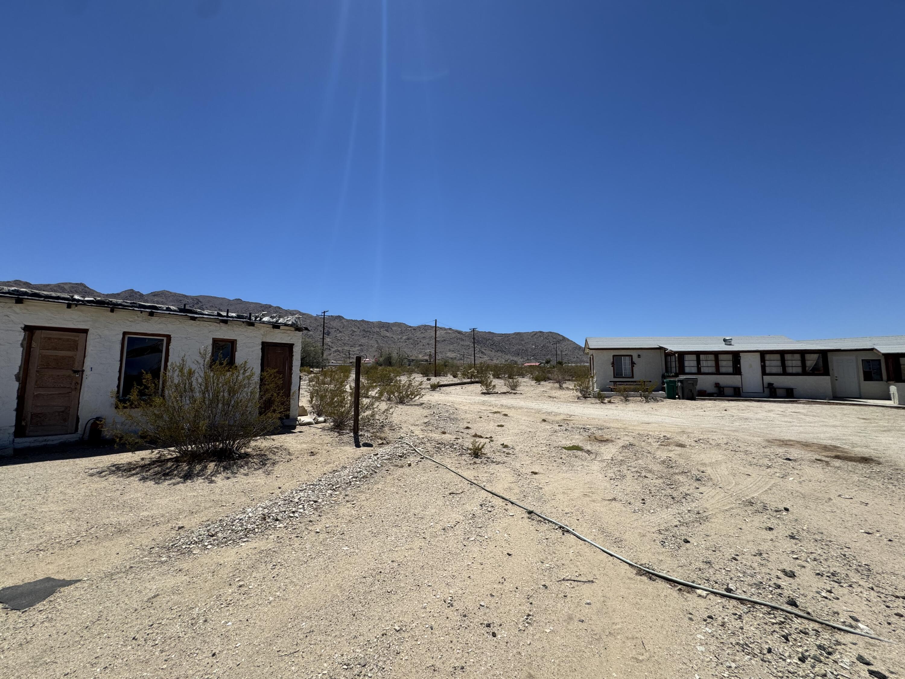 73392 Sullivan Road Twentynine Palms, CA 92277 - Photo 13 of 29 a view of a road with a yard