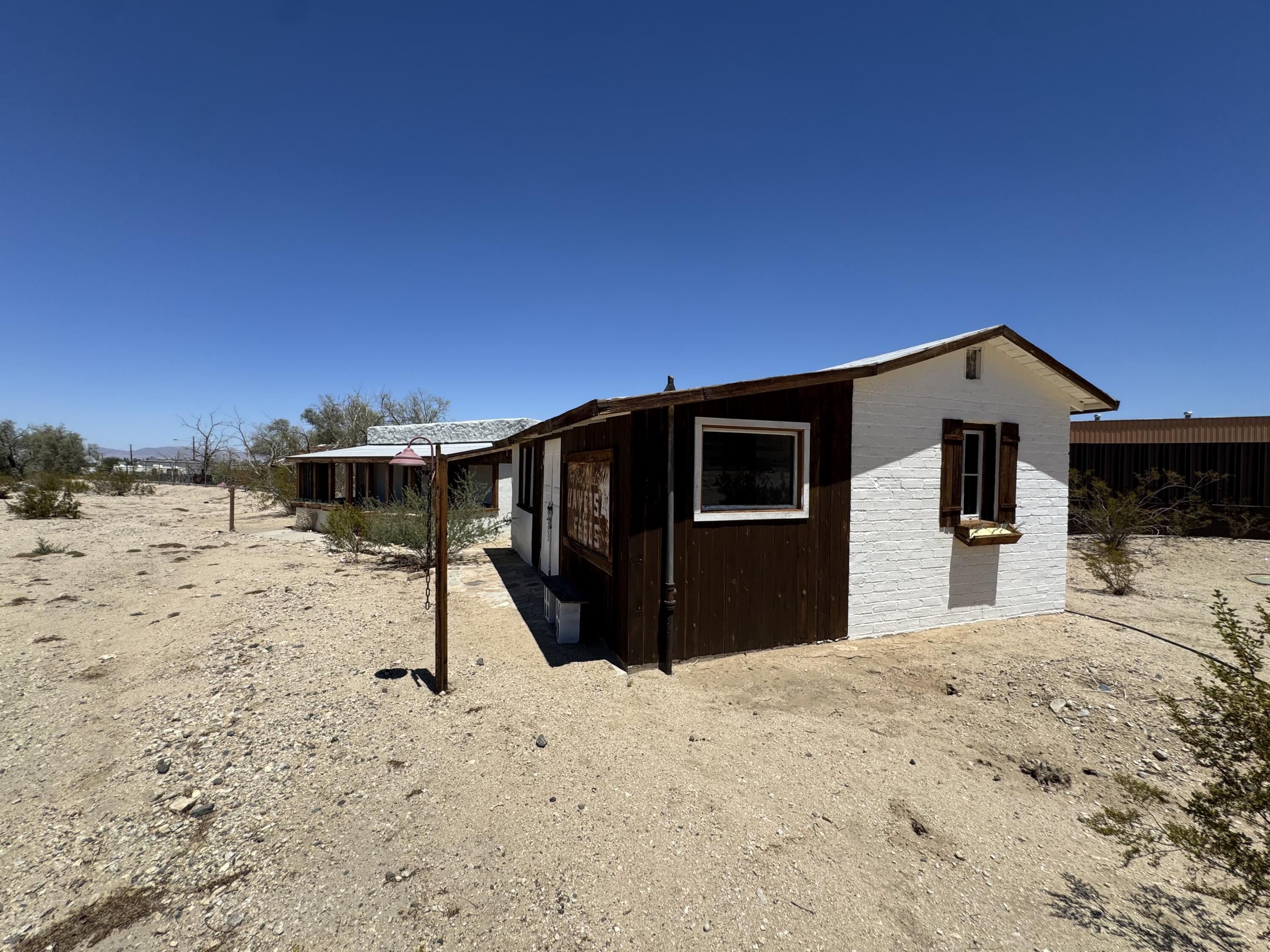 73392 Sullivan Road Twentynine Palms, CA 92277 - Photo 17 of 29 a front view of a house with a yard