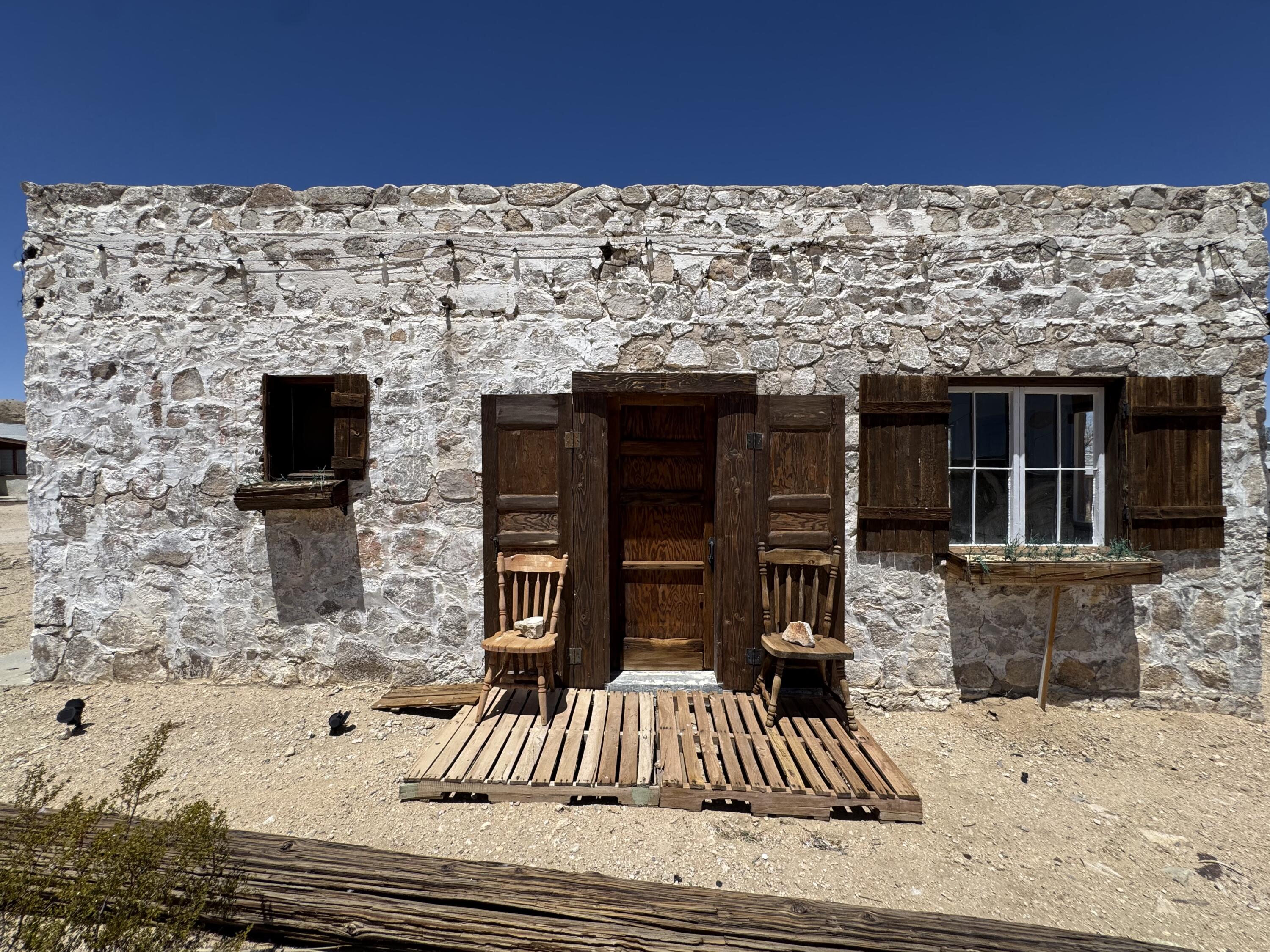 73392 Sullivan Road Twentynine Palms, CA 92277 - Photo 2 of 29 front view of a house with a patio