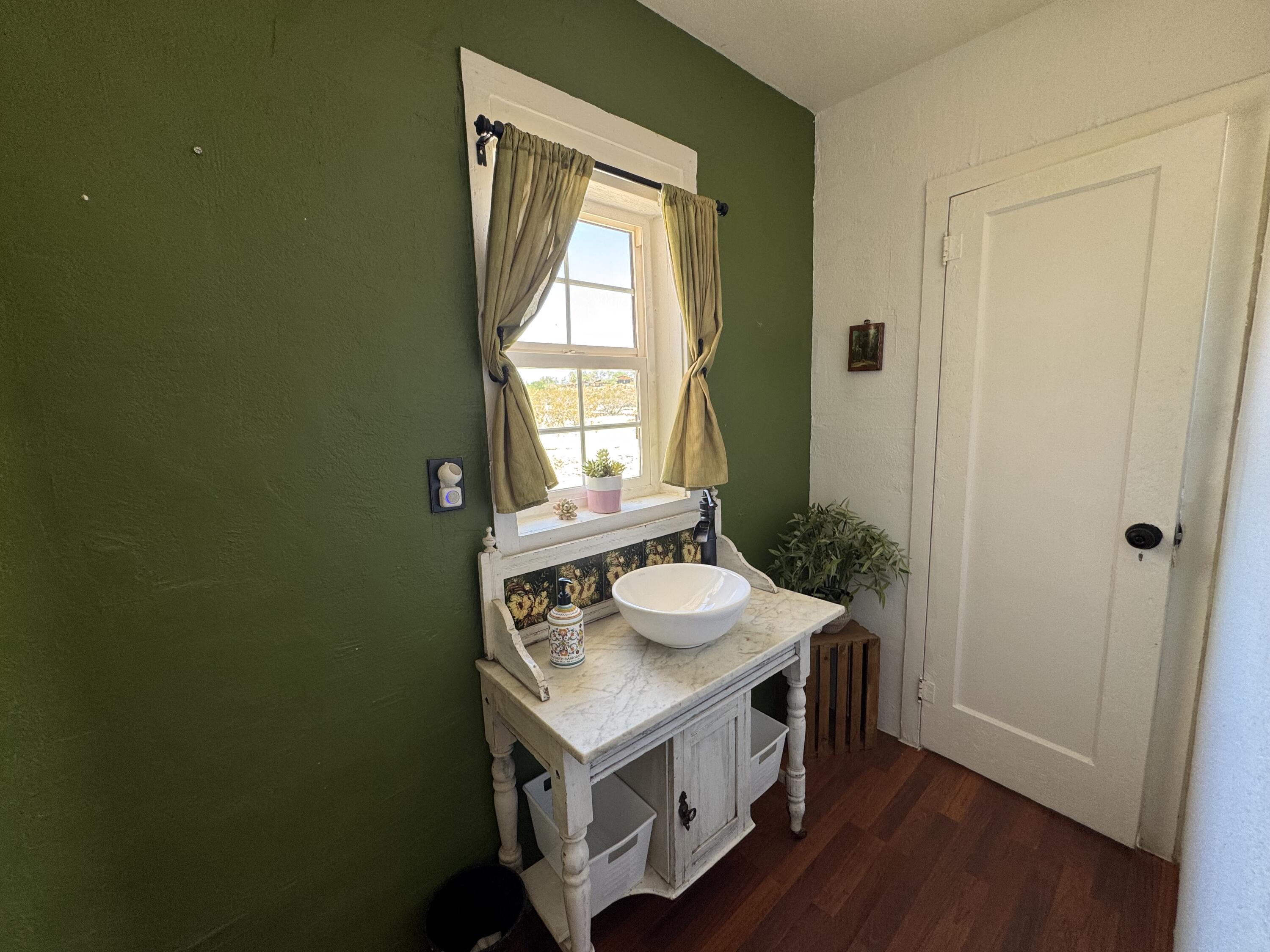73392 Sullivan Road Twentynine Palms, CA 92277 - Photo 27 of 29 a view of kitchen with a sink and wooden floor