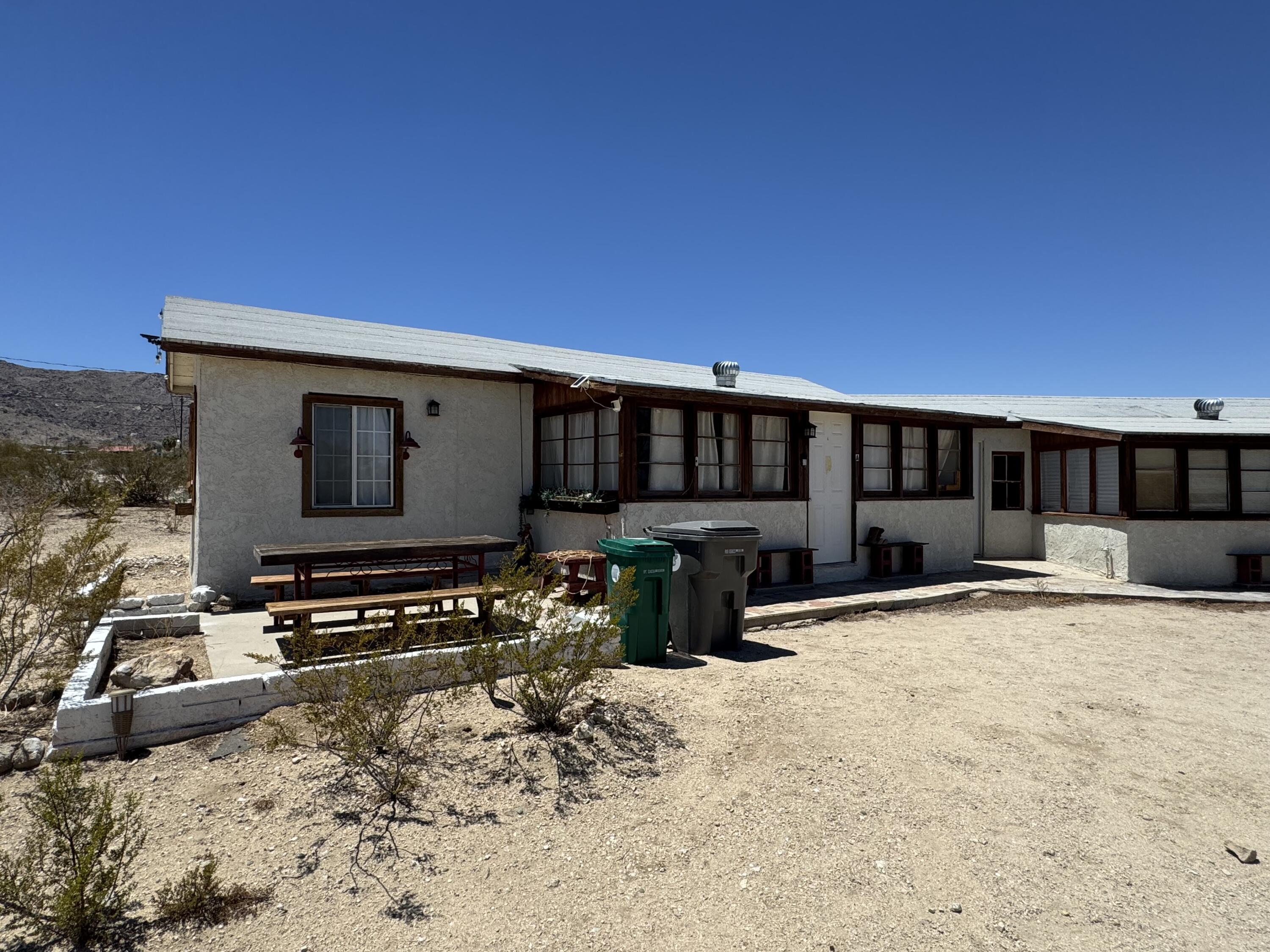 73392 Sullivan Road Twentynine Palms, CA 92277 - Photo 10 of 29 a view of a house with a patio