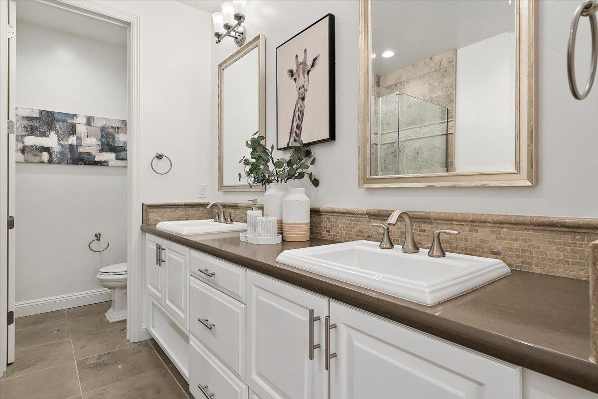 3003 Marcelli Circle Los Altos, CA 94022 - Photo 19 of 21 a bathroom with a toilet sink and mirror
