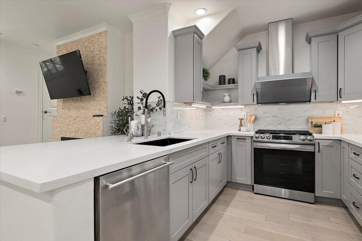 3003 Marcelli Circle Los Altos, CA 94022 - Photo 7 of 21 a kitchen with stainless steel appliances a stove microwave and sink