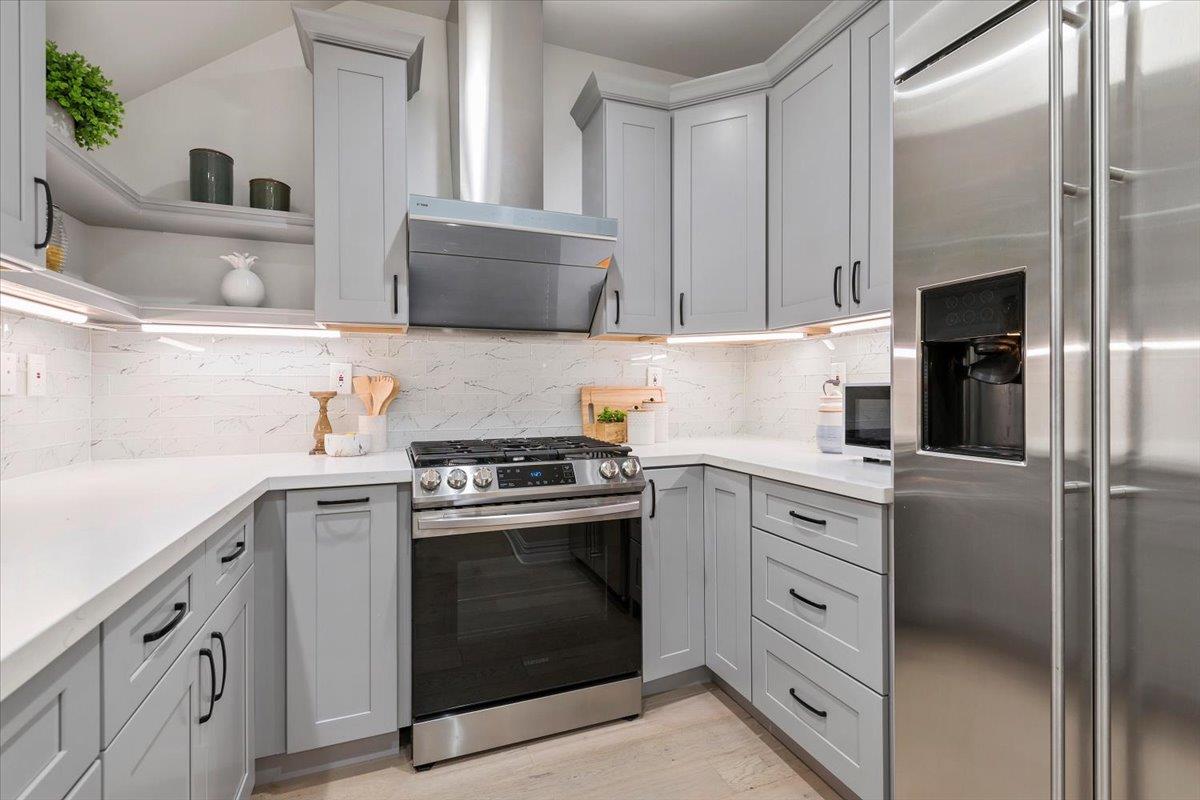 3003 Marcelli Circle Los Altos, CA 94022 - Photo 8 of 21 a kitchen with cabinets stainless steel appliances and sink