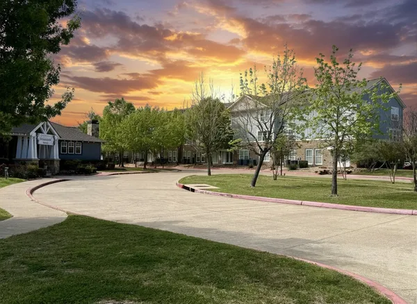 a view of a playground with basketball court