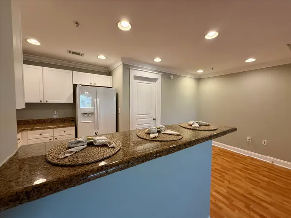 a bathroom with sink granite and a mirror