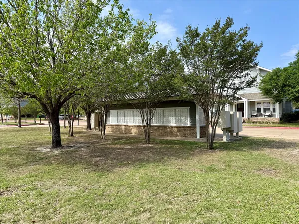 a view of a swimming pool and a yard