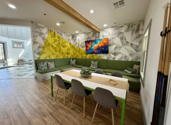 a room with gym equipment and a rug