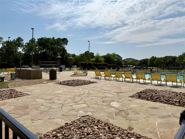 a view of a backyard with sitting area