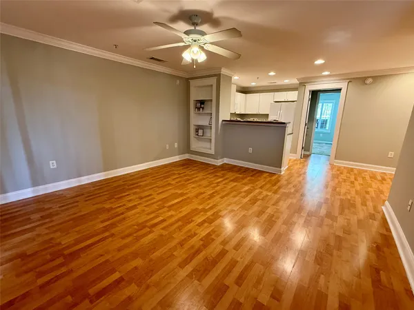 a view of a kitchen with a sink and a window