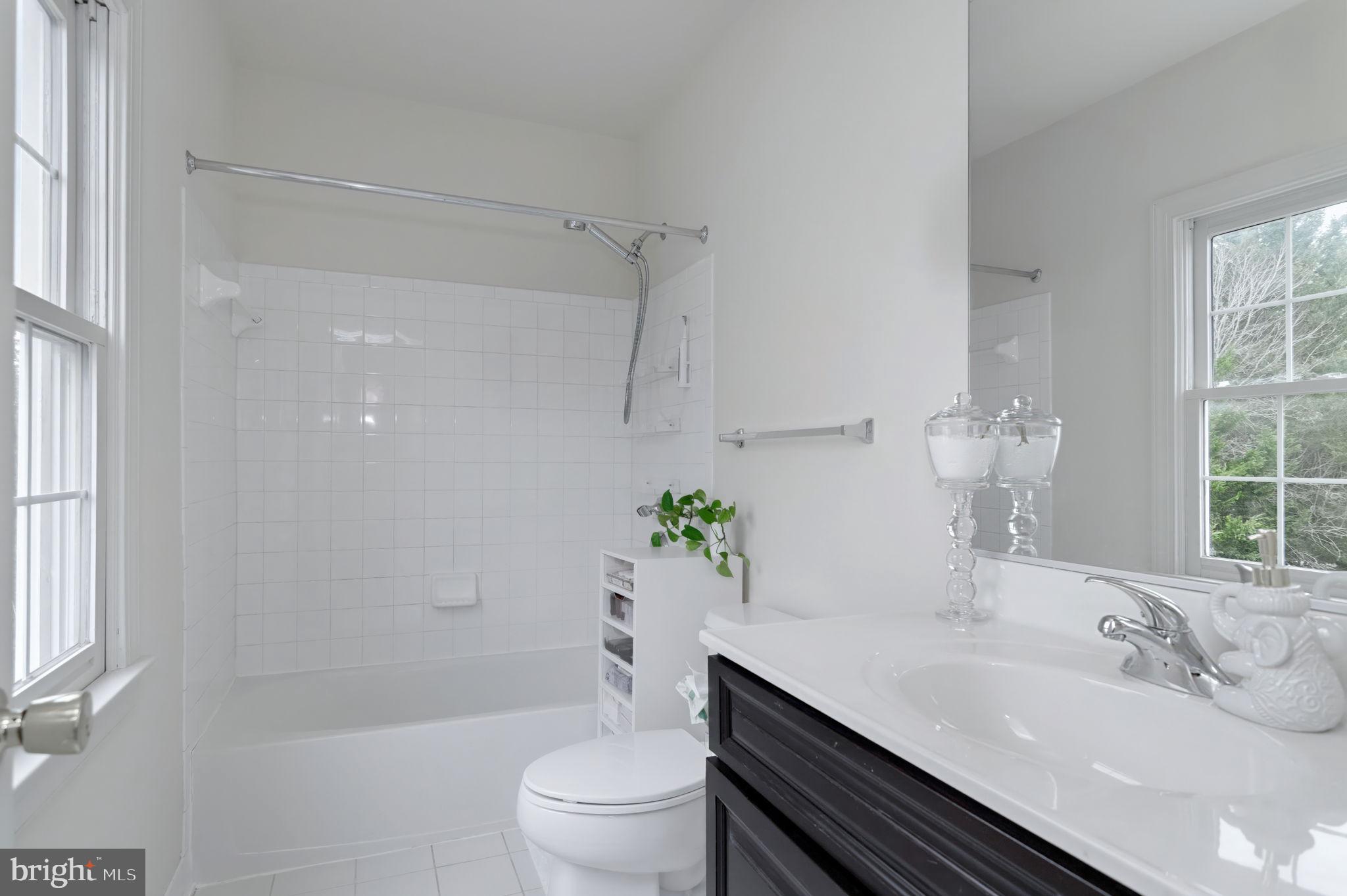 11375 Harding Road Laurel, MD 20723 - Photo 26 of 40 a bathroom with a sink toilet and shower