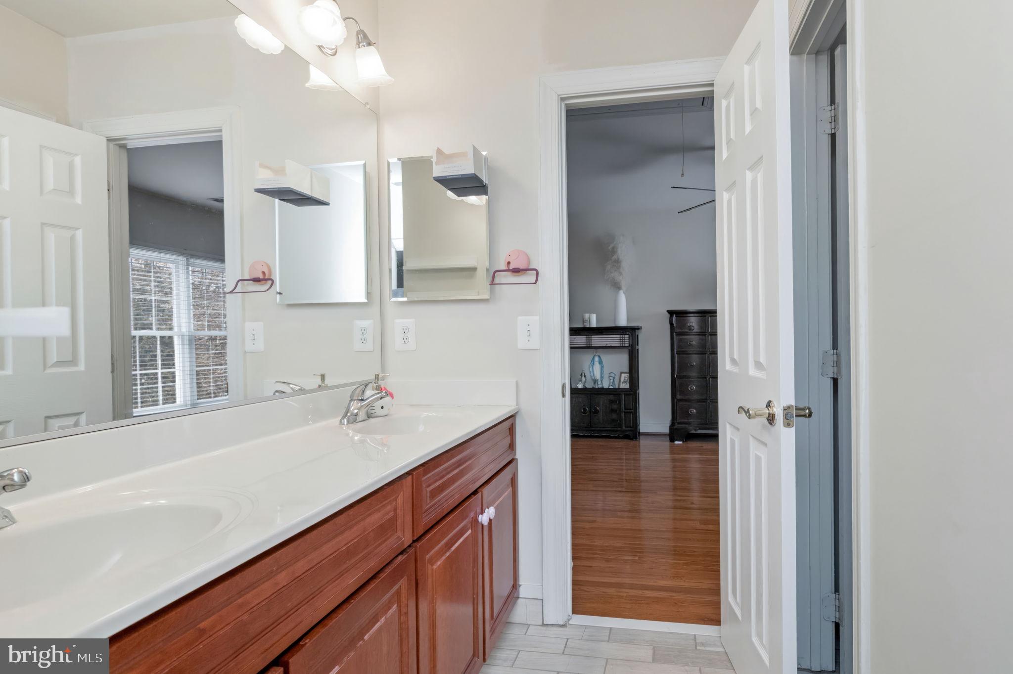 11375 Harding Road Laurel, MD 20723 - Photo 30 of 40 a bathroom with a sink and a mirror
