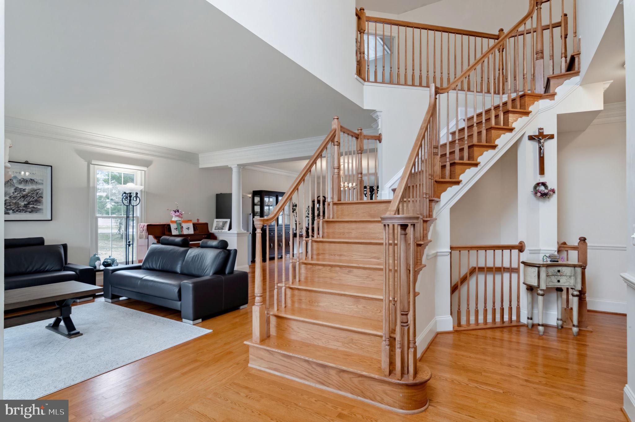 11375 Harding Road Laurel, MD 20723 - Photo 3 of 40 a livingroom with furniture staircase and a living room
