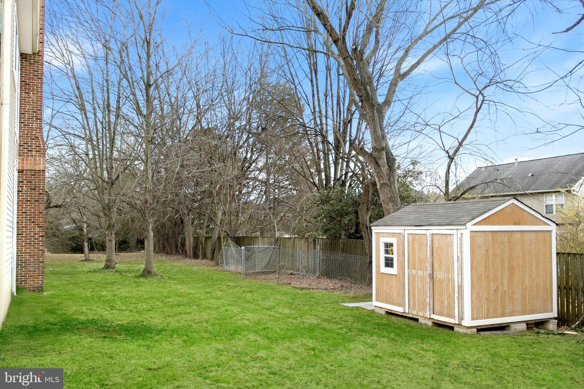 11375 Harding Road Laurel, MD 20723 - Photo 38 of 40 a view of a house with backyard and a tree