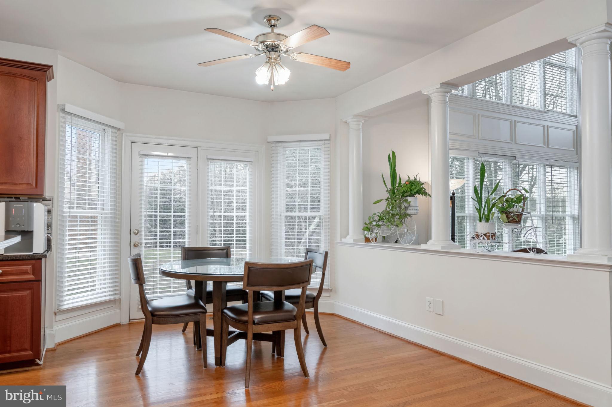11375 Harding Road Laurel, MD 20723 - Photo 10 of 40 a view of a dining room with furniture window and wooden floor