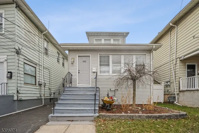 a view of a house with a window and stairs