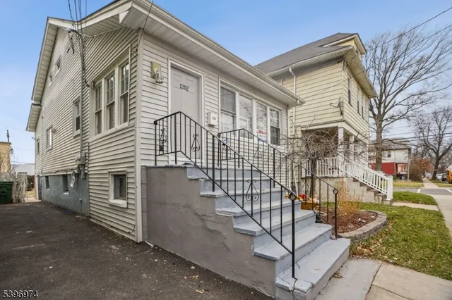 a view of a house with a street