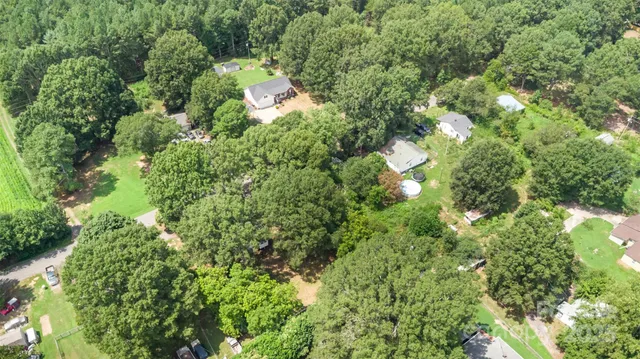 a view of a house with a tree