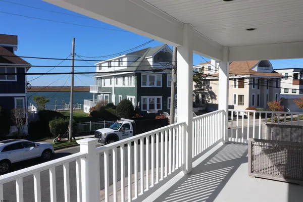 a view of a house with wooden deck