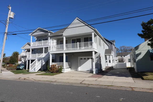 a front view of a house with a ocean view