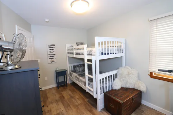 a bedroom with furniture and a window