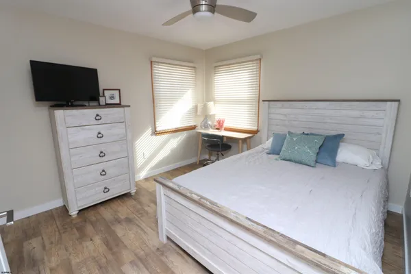 a bed room with a bed and a television