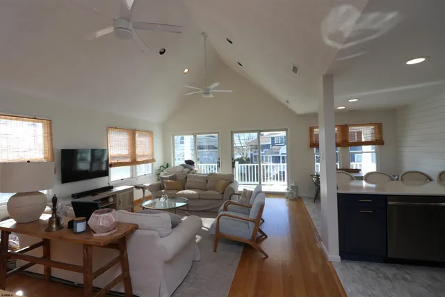 a living room with furniture fireplace and a flat screen tv