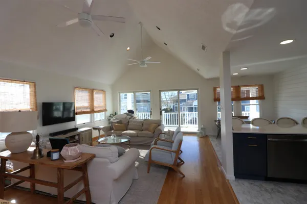 a living room with furniture fireplace and a flat screen tv