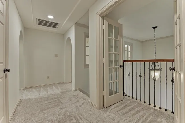 a view of a hallway with closet area