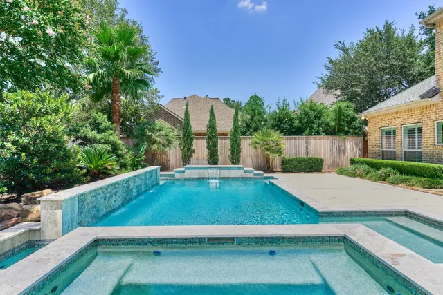 a view of a pool with a yard