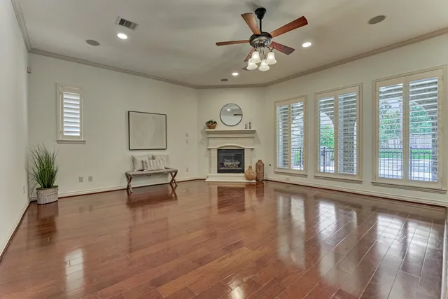 a view of a livingroom with furniture window and wooden floor