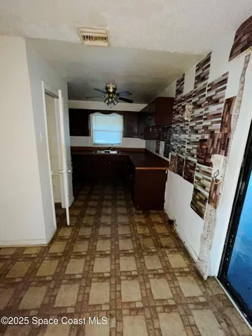 a room with a sink and a mirror