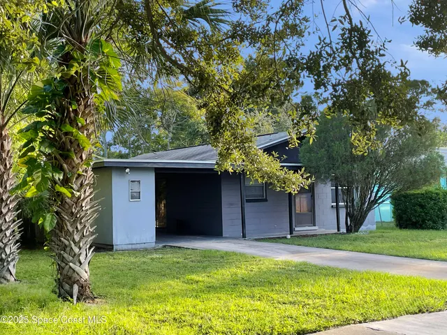 a backyard of a house with lots of green space