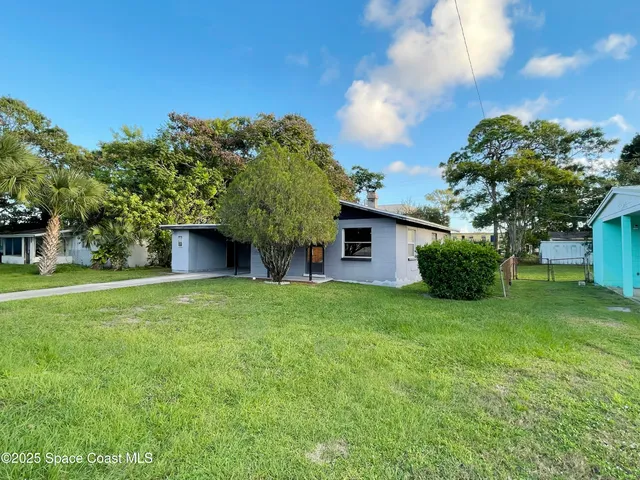 a view of a hallway with a chandelier