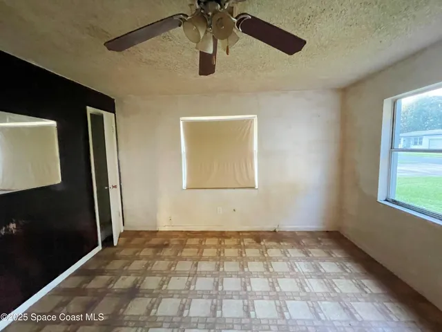 a view of a hallway with a chandelier