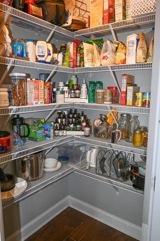 a kitchen with an oven a sink and a large window