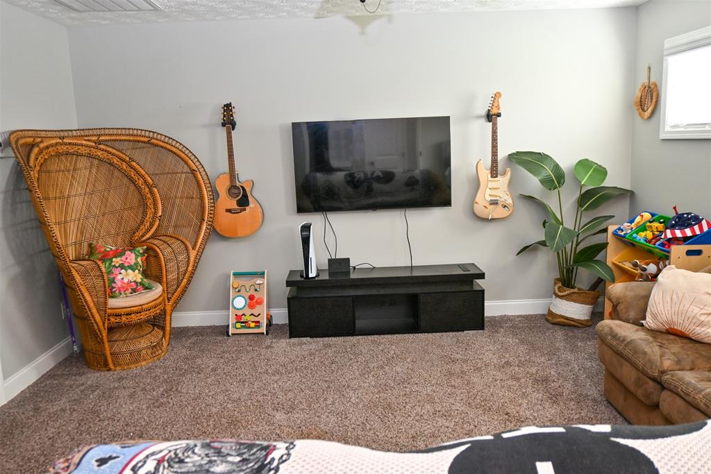 7263 Double Pine Drive Midland, GA 31820 - Photo 25 of 44 a living room with furniture and a flat screen tv