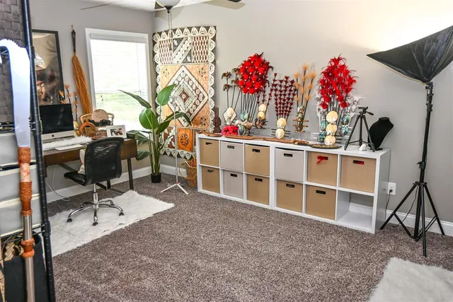 a view of a workspace with furniture