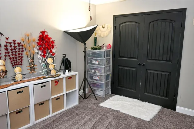 a kitchen with a refrigerator and cabinets