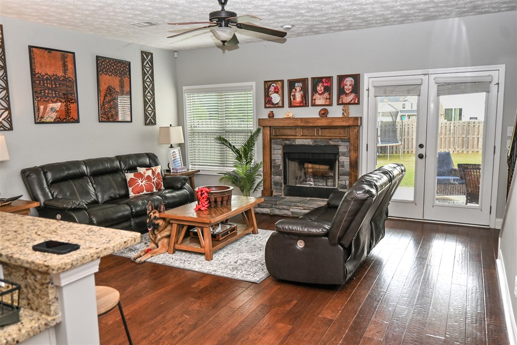 7263 Double Pine Drive Midland, GA 31820 - Photo 10 of 44 a living room with furniture and a fireplace