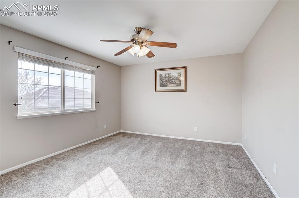 409 Avocet Loop Colorado Springs, CO 80921 - Photo 17 of 34 a view of an empty room with a window