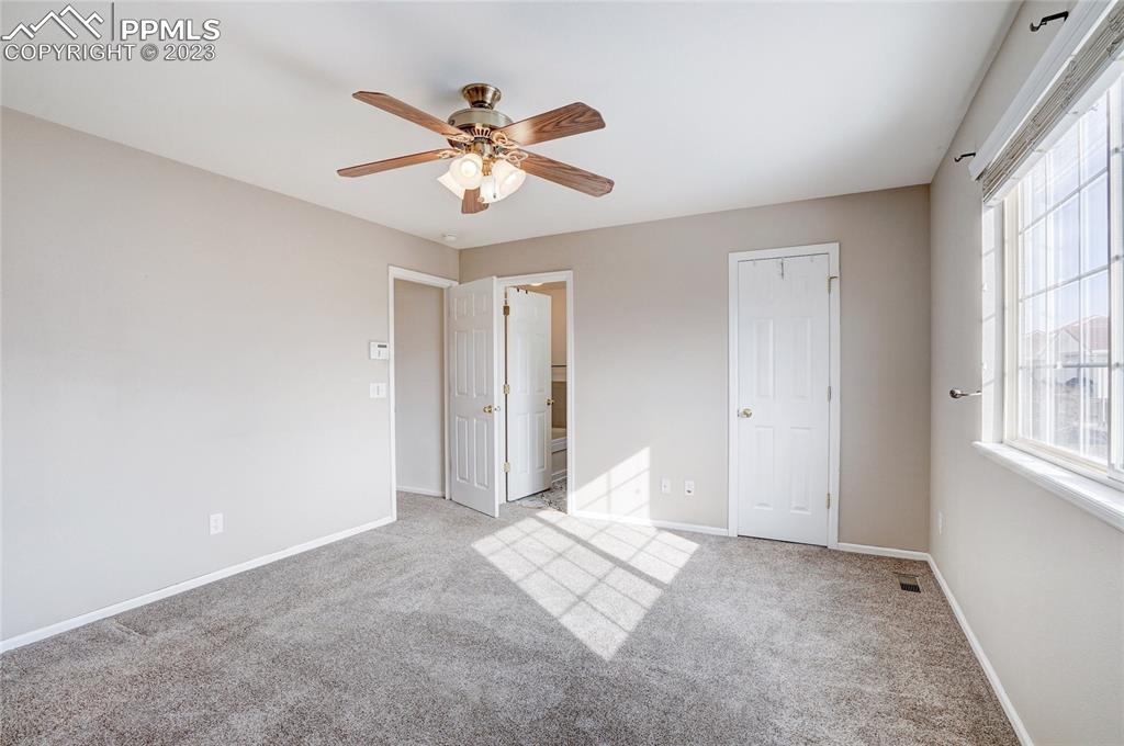 409 Avocet Loop Colorado Springs, CO 80921 - Photo 18 of 34 a view of an empty room with a window