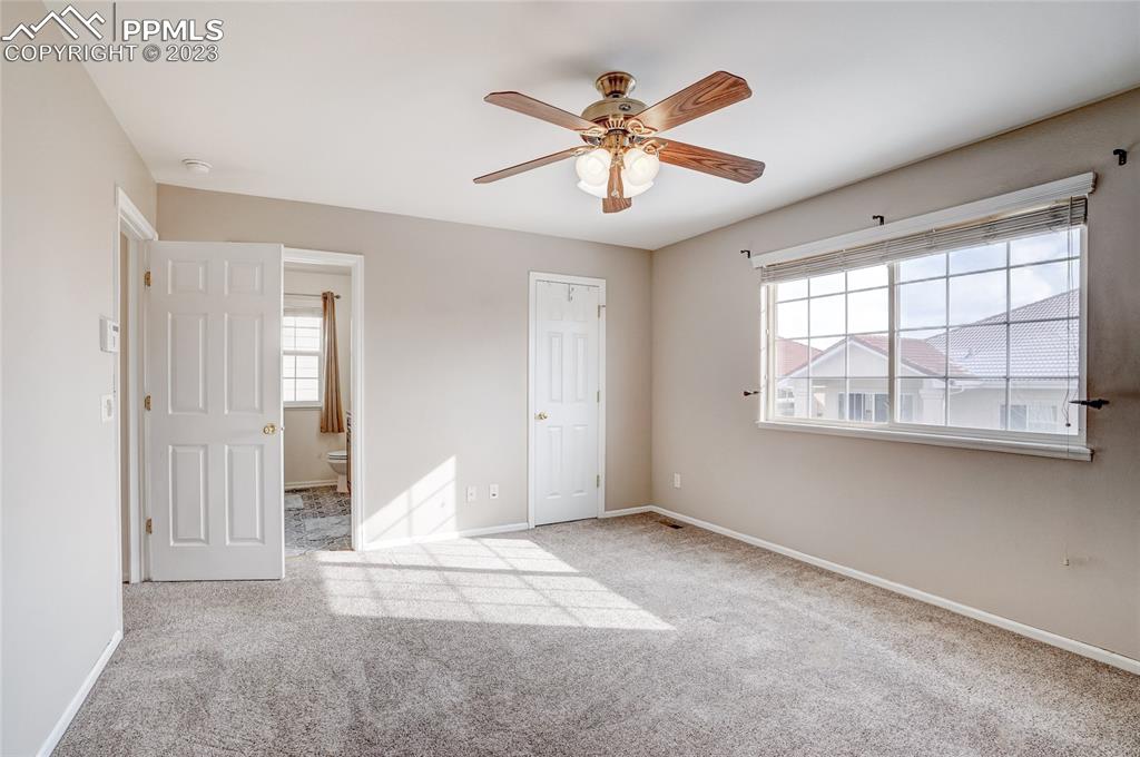 409 Avocet Loop Colorado Springs, CO 80921 - Photo 19 of 34 a view of an empty room with a window